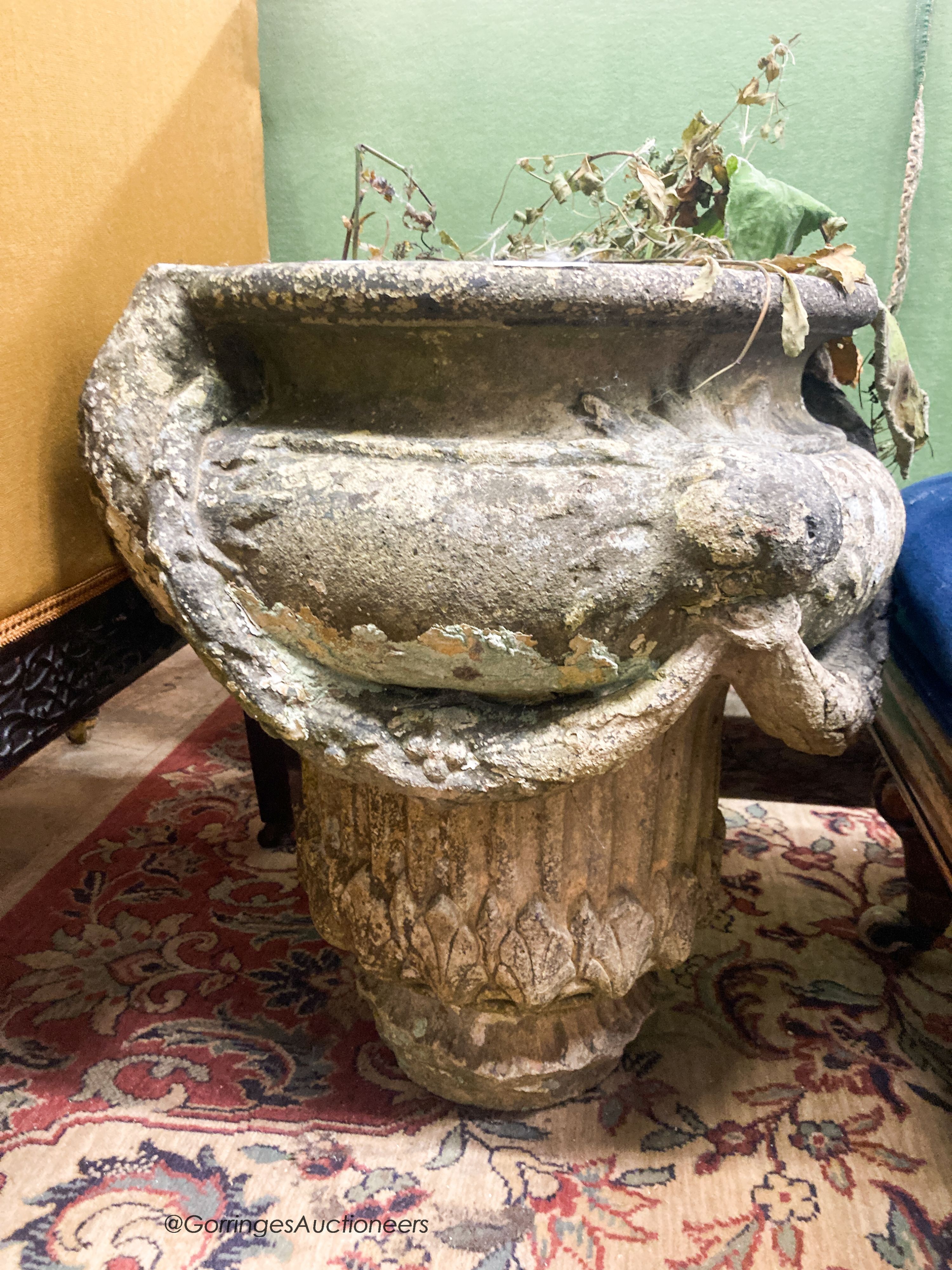 A reconstituted stone garden planter, diameter 50cm H.54cm